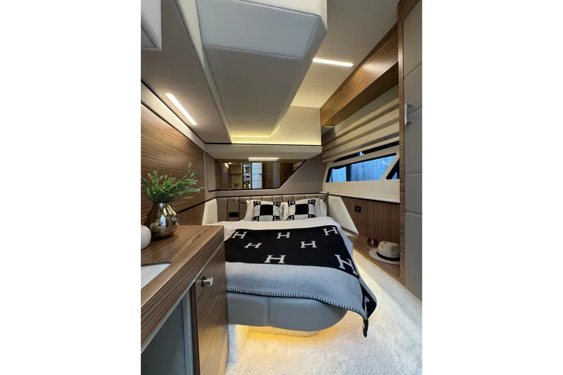  Yacht Photos Pics Luxurious interior of 2025 Cobrey 42 FLY yacht with modern design and cozy bedroom.