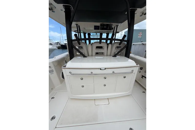  Yacht Photos Pics 2022 Boston Whaler 380 Outrage boat interior with storage compartments and seating.