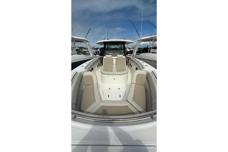  Yacht Photos Pics 2022 Boston Whaler 380 Outrage boat with spacious seating and sleek design.