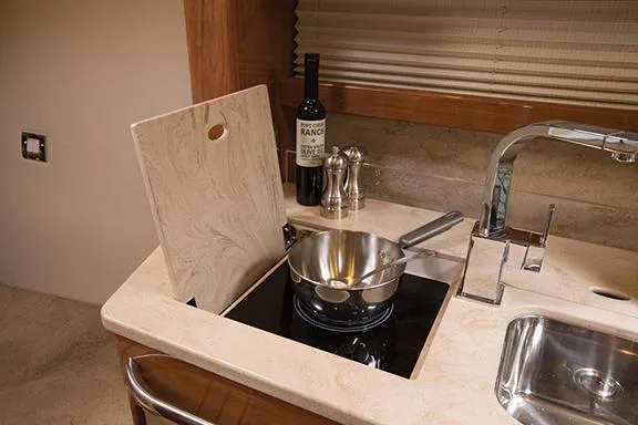 Wet Benefits Yacht Photos Pics Manufacturer Provided Image: Modern kitchen area in 2015 Formula 370 Super Sport boat.