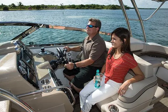 Wet Benefits Yacht Photos Pics Manufacturer Provided Image: Man and woman enjoying a ride on a 2015 Formula 370 Super Sport boat.