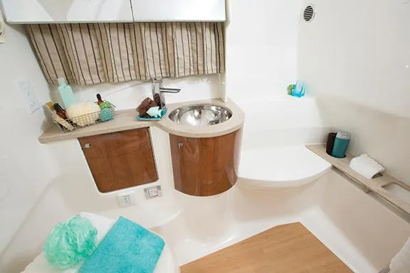 Wet Benefits Yacht Photos Pics Manufacturer Provided Image: 2015 Formula 370 Super Sport boat bathroom with sink, storage, and modern amenities.