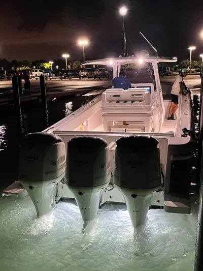 Towa VII Yacht Photos Pics 2016 Intrepid 375 Center Console boat with triple Yamaha engines docked at night.
