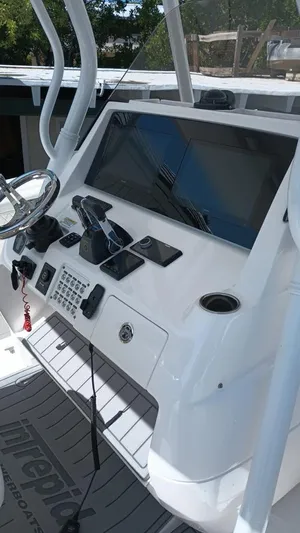 Towa VII Yacht Photos Pics 2016 Intrepid 375 Center Console boat dashboard with steering wheel and navigation controls.