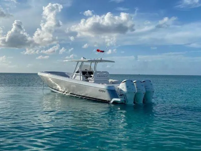 Towa VII Yacht Photos Pics 2016 Intrepid 375 Center Console boat on calm ocean waters under a partly cloudy sky.