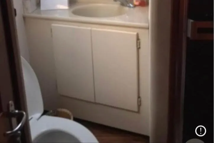 Double Deese Yacht Photos Pics Small bathroom with sink and toilet in 1989 Viking Fish model.