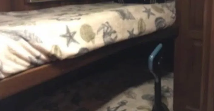 Double Deese Yacht Photos Pics Bunk bed with nautical-themed bedding in a 1989 Viking Fish model interior.