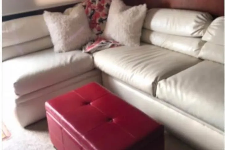 Double Deese Yacht Photos Pics White leather sectional with red ottoman, Viking fish model, 1989.