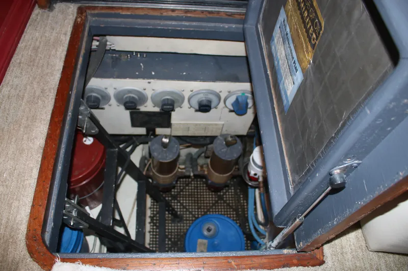 Double Deese Yacht Photos Pics Engine compartment of a 1989 Viking fish model, showcasing mechanical components and controls.