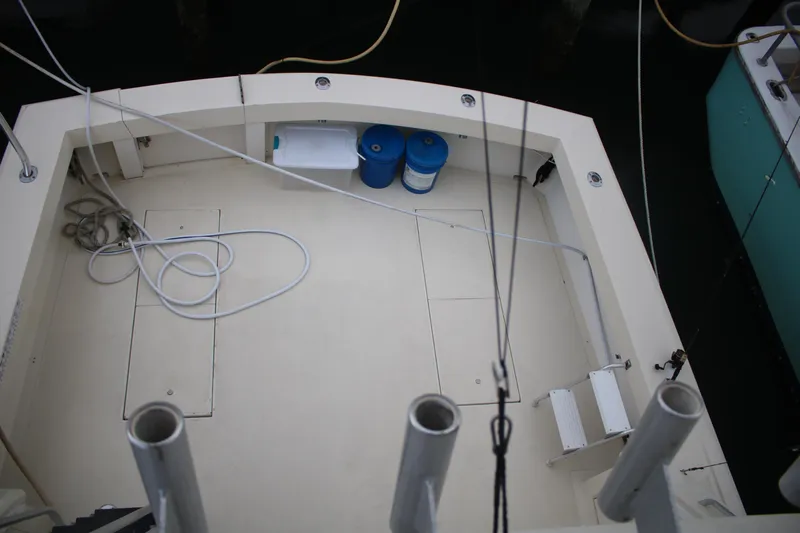 Double Deese Yacht Photos Pics 1989 Viking fish boat deck with storage compartments and fishing rod holders.