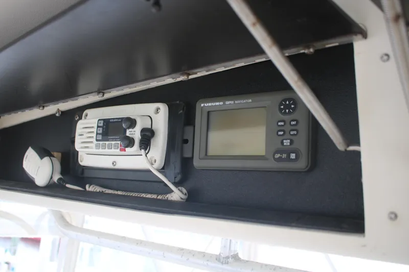 Double Deese Yacht Photos Pics 1989 Viking fish boat dashboard with radio and navigation equipment.