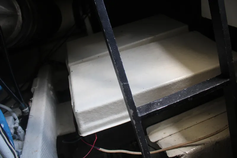 Double Deese Yacht Photos Pics Interior of a 1989 Viking fish boat, showing engine compartment and ladder.