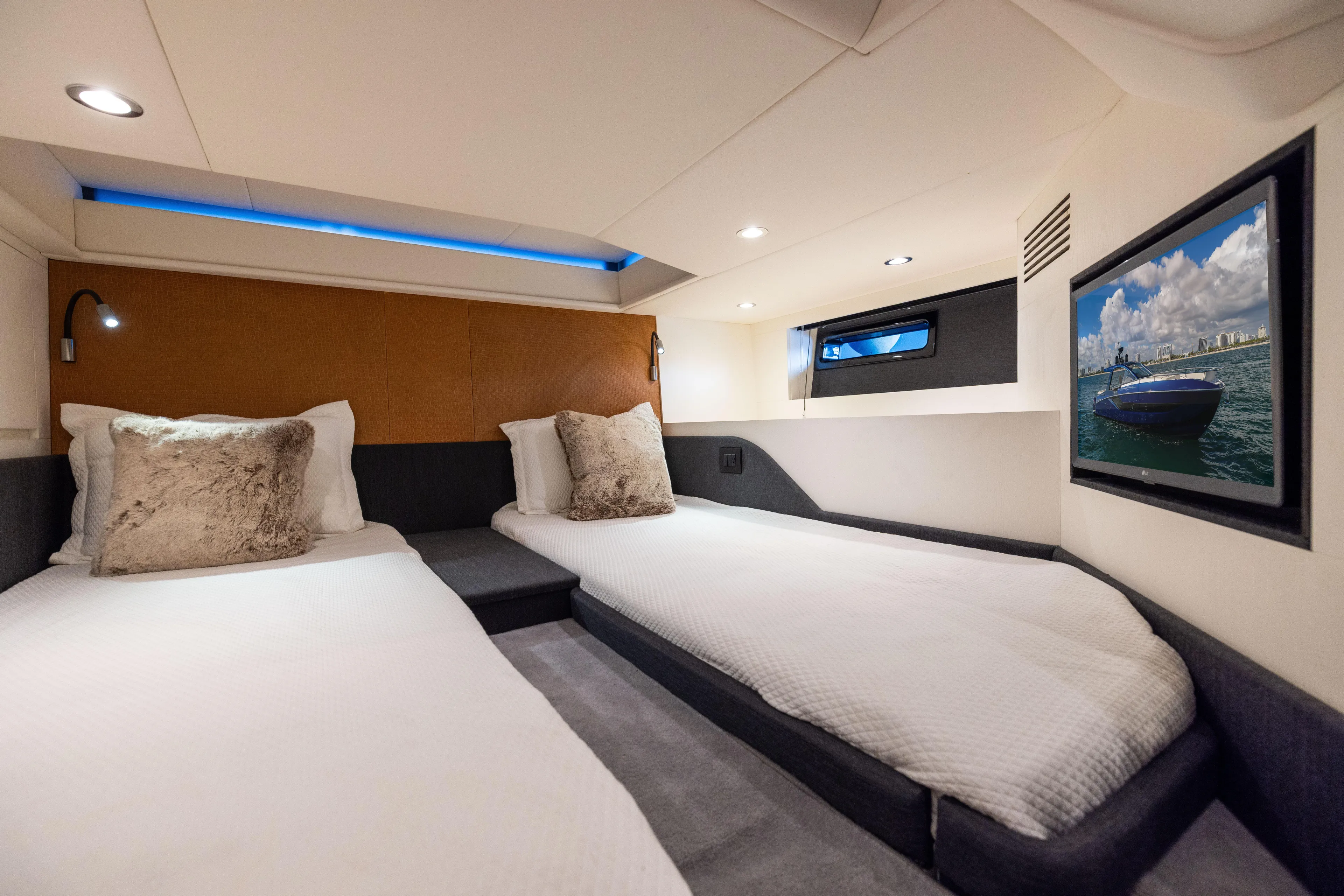  Yacht Photos Pics Luxurious cabin interior of 2022 Azimut Verve 47 yacht with twin beds and modern decor.