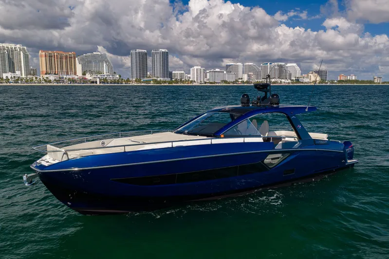  Yacht Photos Pics Azimut Verve 47 yacht cruising near a city skyline, 2022 model.