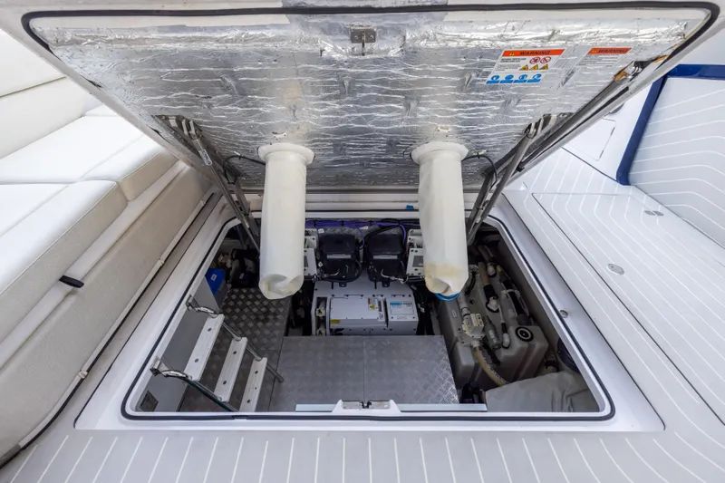  Yacht Photos Pics Engine compartment of 2022 Azimut Verve 47 yacht, showcasing mechanical components and access ladder.
