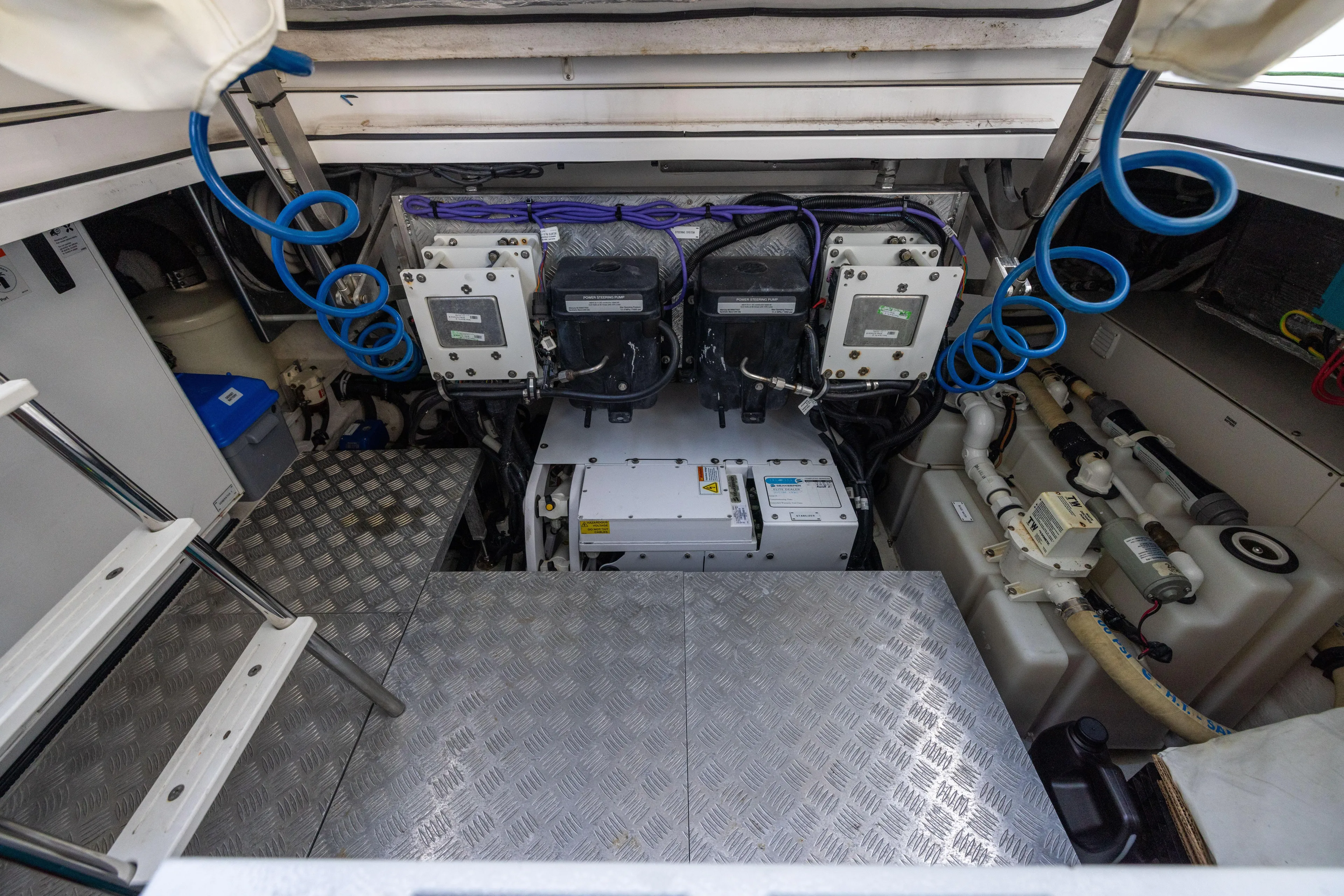  Yacht Photos Pics Engine room of 2022 Azimut Verve 47 yacht with mechanical components and wiring.