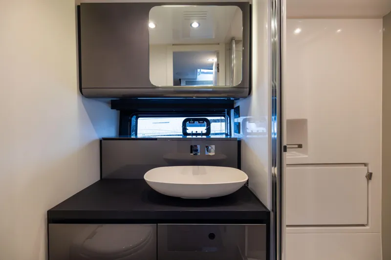  Yacht Photos Pics Modern bathroom interior on 2022 Azimut Verve 47 yacht, featuring sleek design and elegant fixtures.