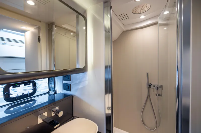  Yacht Photos Pics Luxurious bathroom interior of 2022 Azimut Verve 47 yacht with modern shower and fixtures.