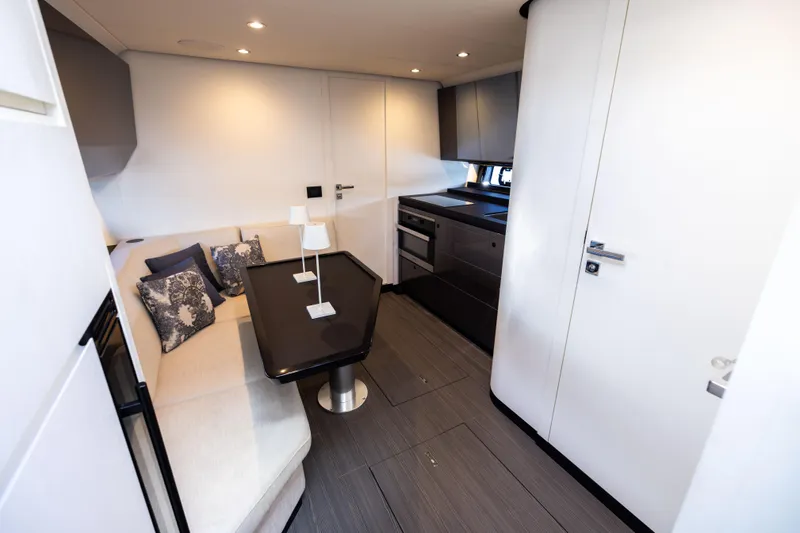  Yacht Photos Pics Luxurious interior of 2022 Azimut Verve 47 yacht with modern kitchen and seating area.