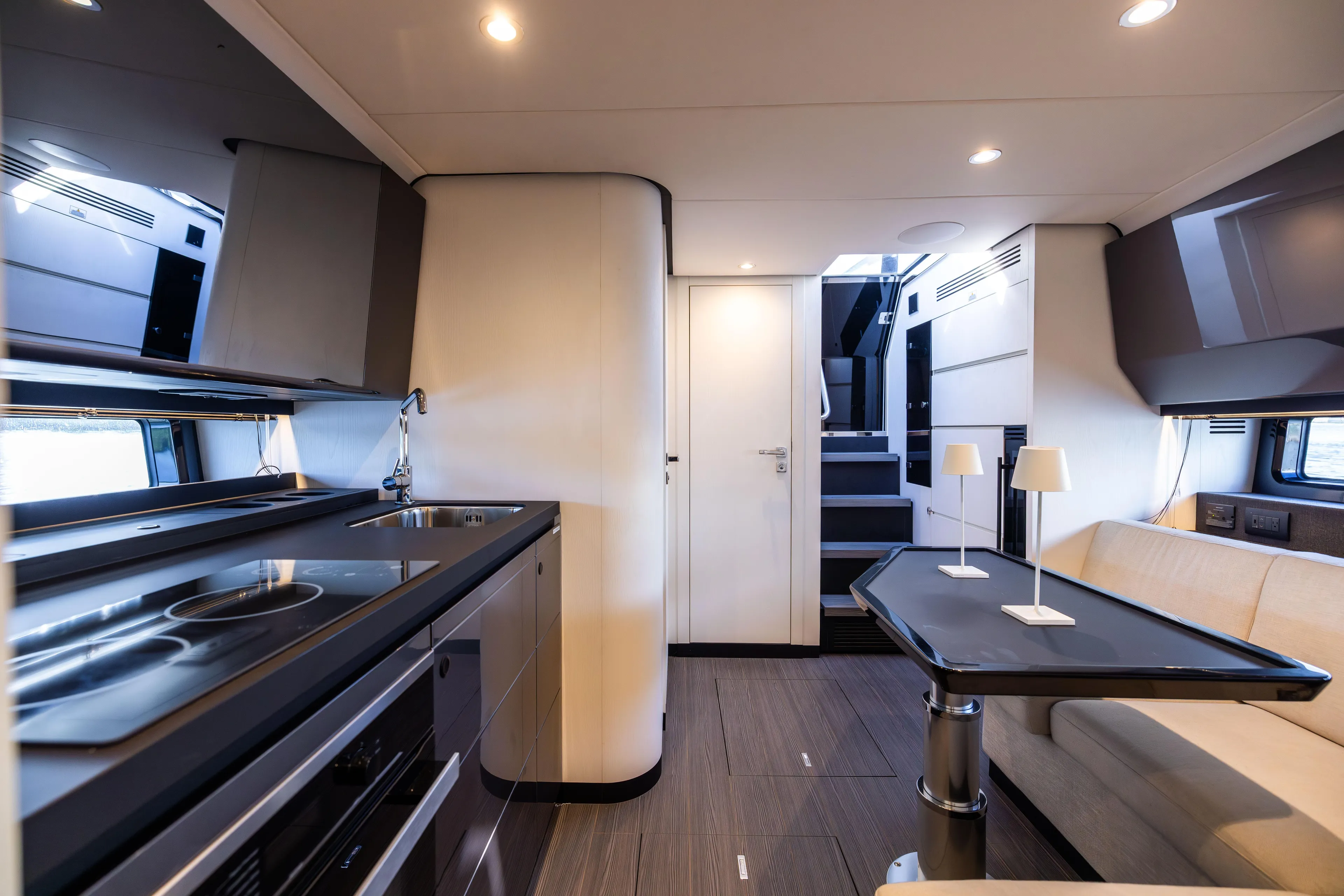  Yacht Photos Pics Luxurious interior of 2022 Azimut Verve 47 yacht with modern kitchen and seating area.