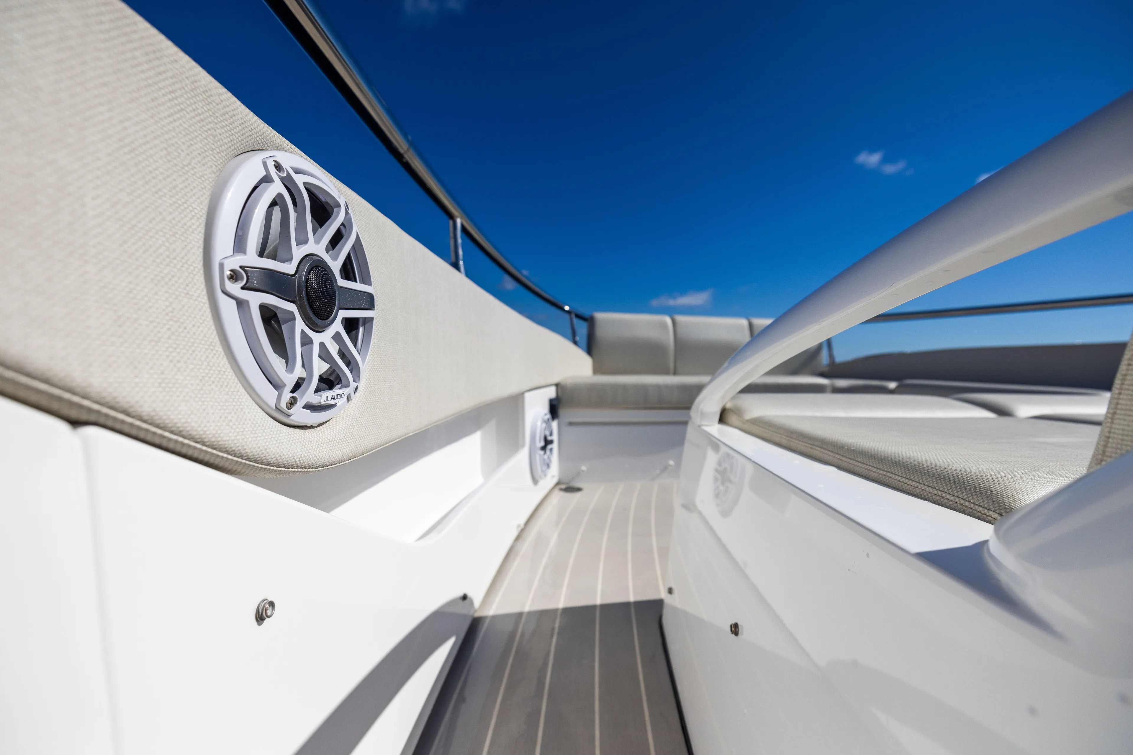  Yacht Photos Pics 2022 Azimut Verve 47 yacht deck with speaker, sleek design, and clear blue sky.