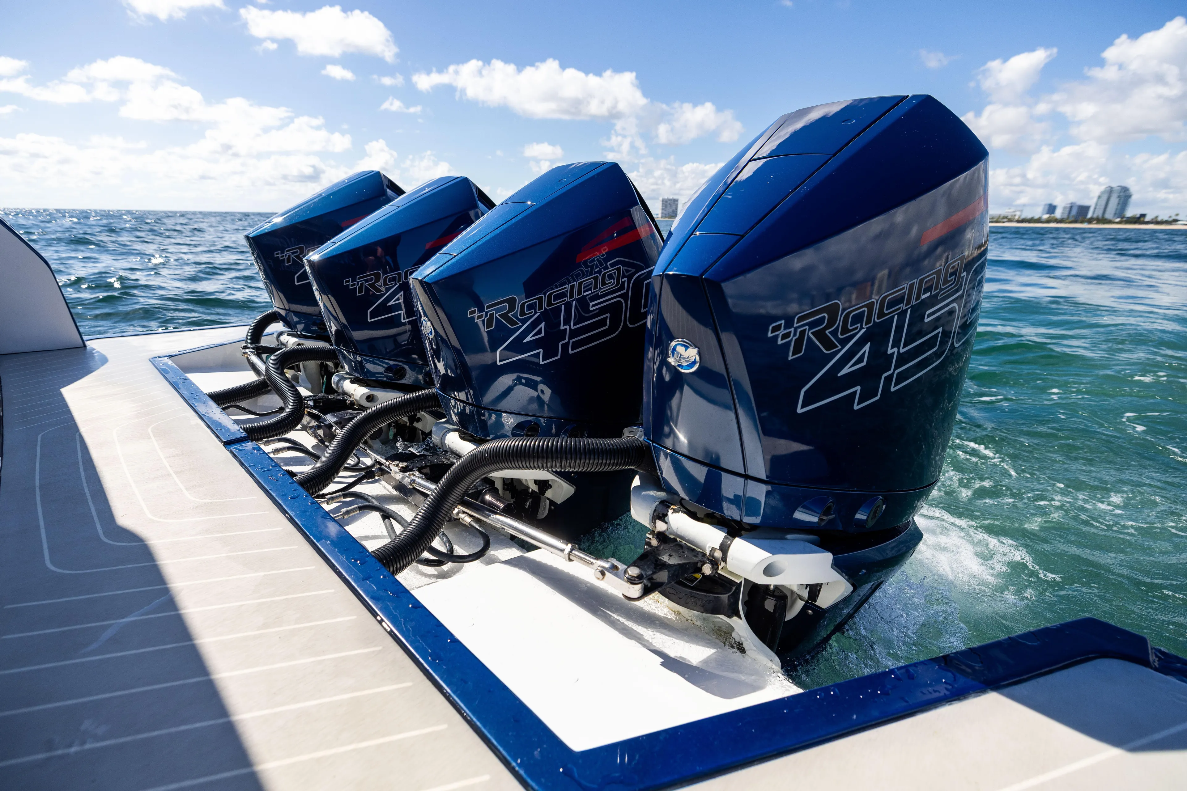  Yacht Photos Pics Four powerful outboard engines on a 2022 Azimut Verve 47 yacht in open water.