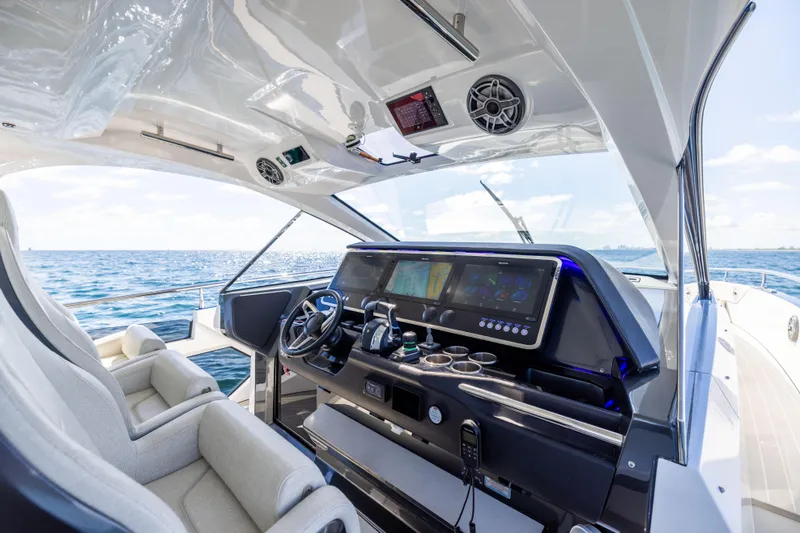  Yacht Photos Pics Luxurious 2022 Azimut Verve 47 yacht cockpit with modern navigation system and ocean view.
