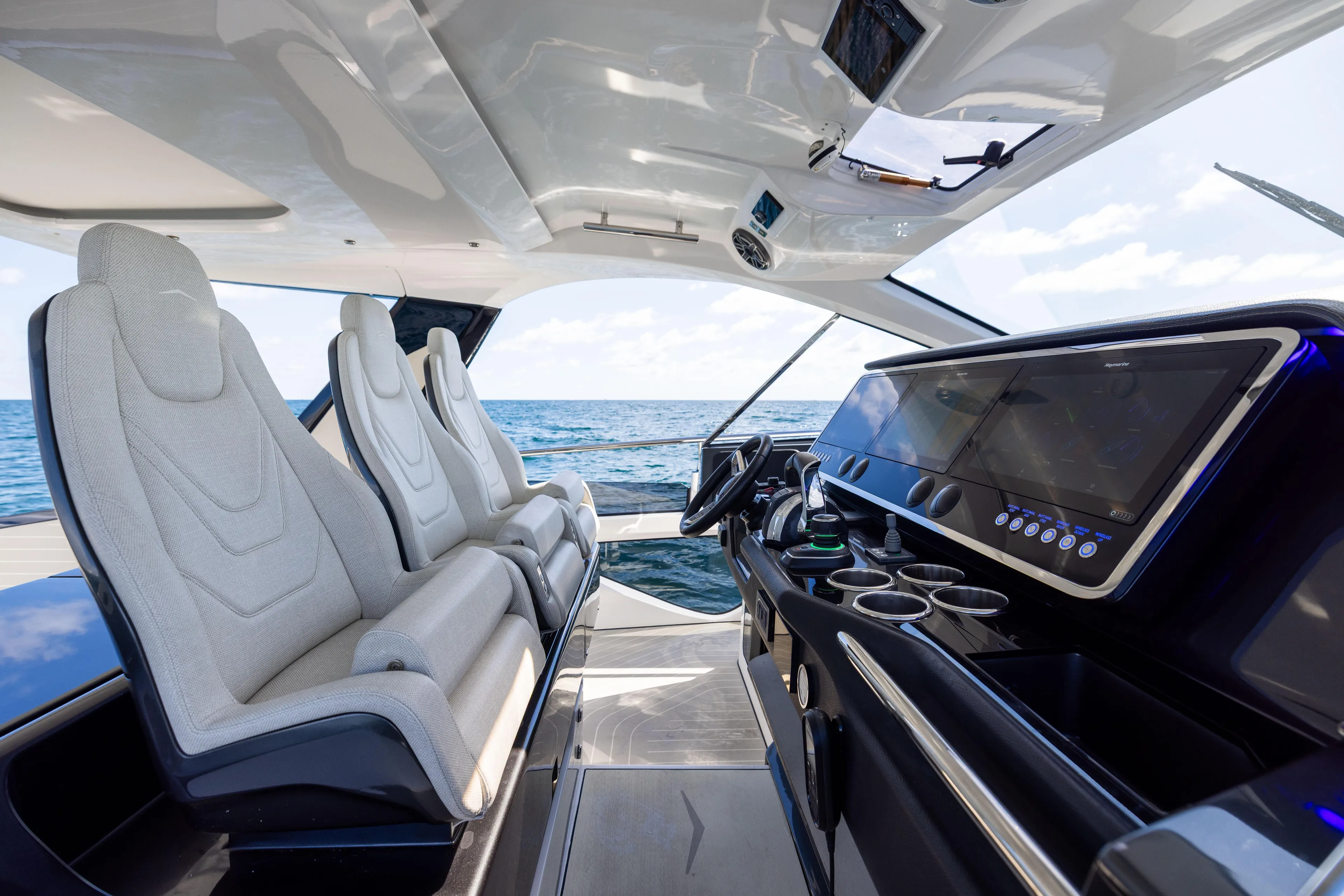  Yacht Photos Pics Interior of 2022 Azimut Verve 47 yacht with modern helm and luxurious seating.