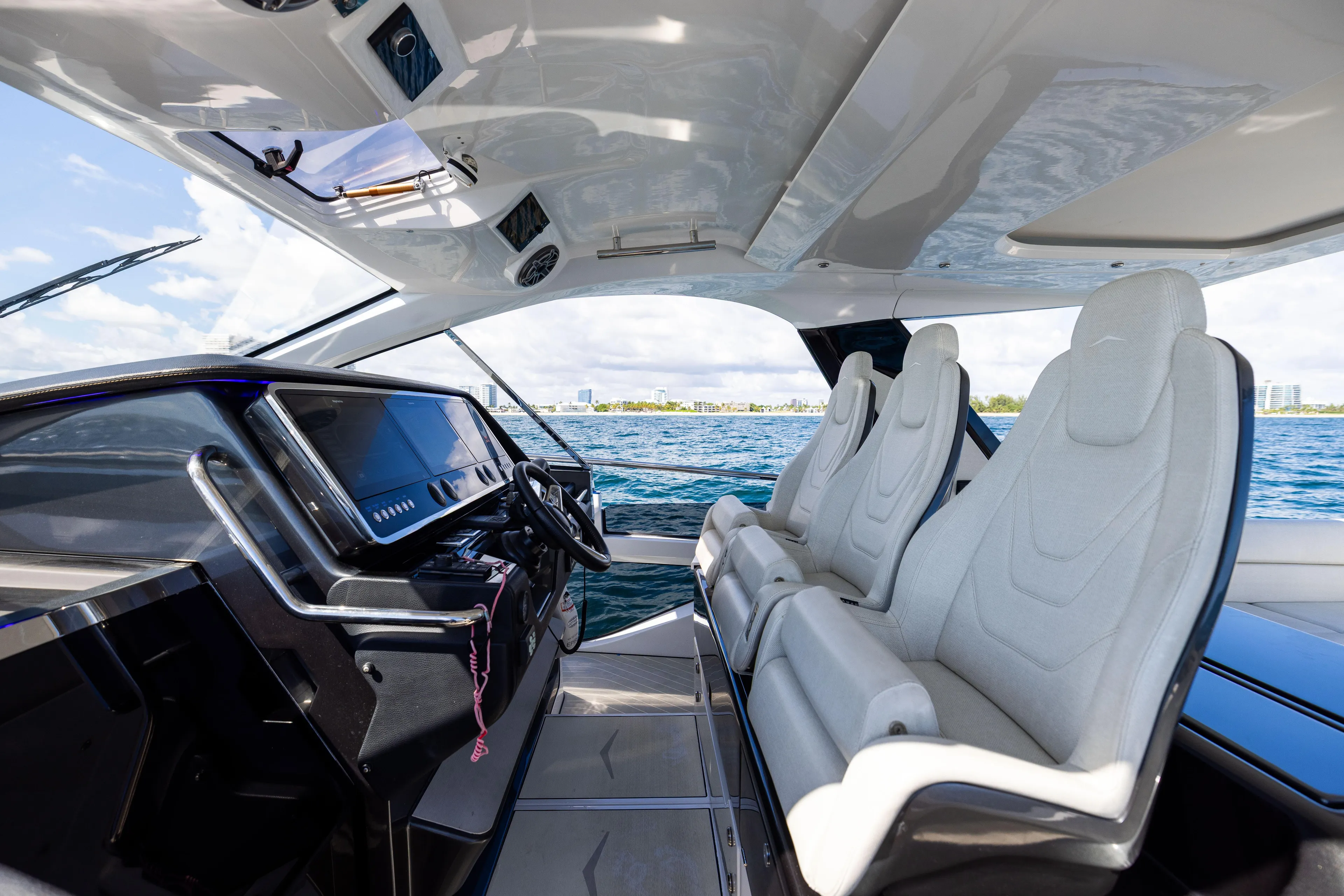  Yacht Photos Pics Interior of 2022 Azimut Verve 47 yacht with modern helm and luxurious seating.