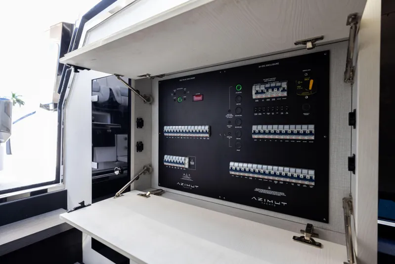  Yacht Photos Pics Electrical panel inside 2022 Azimut Verve 47 yacht, showcasing circuit breakers and controls.