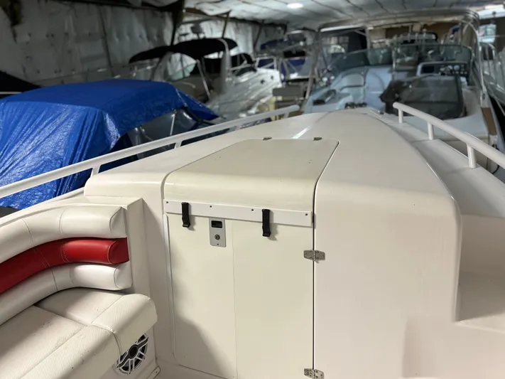  Yacht Photos Pics 2007 Donzi 38 ZF Cuddy boat interior in storage, featuring white and red seating.