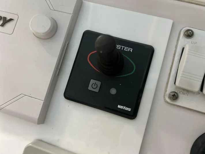  Yacht Photos Pics Control panel of a 2007 Donzi 38 ZF Cuddy boat with joystick and switches.