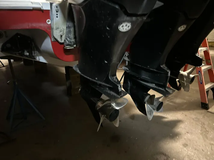  Yacht Photos Pics 2007 Donzi 38 ZF Cuddy boat propellers in a garage setting.