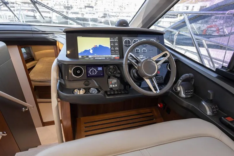  Yacht Photos Pics Helm of 2021 Princess F45 yacht with modern navigation system and luxurious interior.