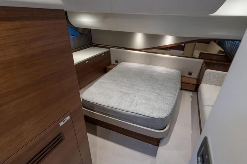  Yacht Photos Pics Luxurious cabin interior of 2021 Princess F45 yacht with modern furnishings and cozy bed.
