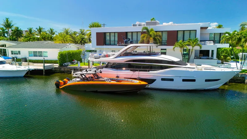  Yacht Photos Pics 2022 Midnight Express 43 Open yacht docked by modern waterfront homes.