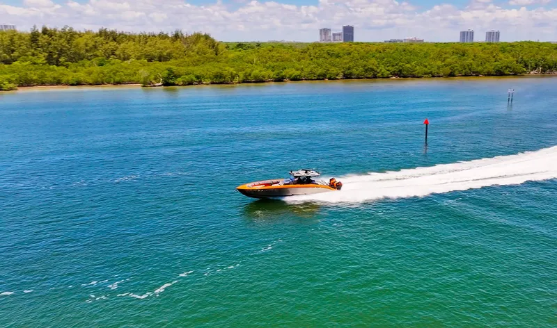  Yacht Photos Pics 2022 Midnight Express 43 Open speedboat cruising on a scenic waterway.