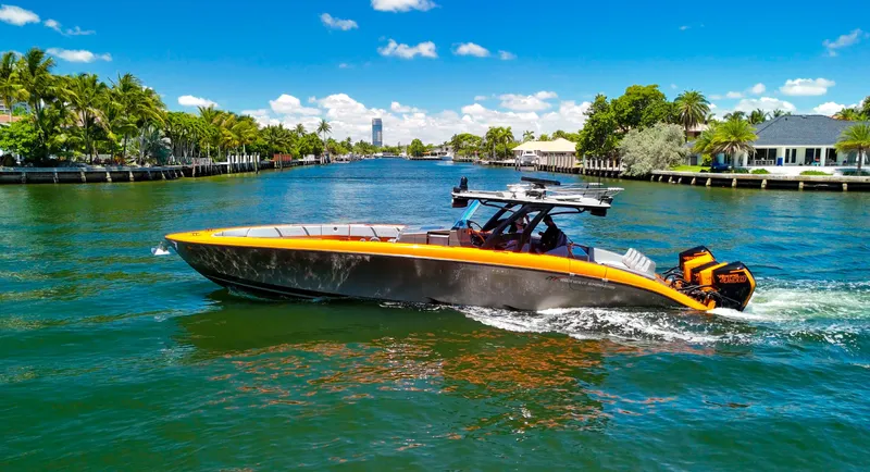  Yacht Photos Pics 2022 Midnight Express 43 Open boat cruising on a sunny, tropical waterway.