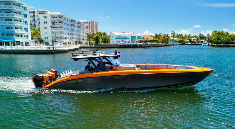  Yacht Photos Pics 2022 Midnight Express 43 Open boat cruising on a sunny waterfront.