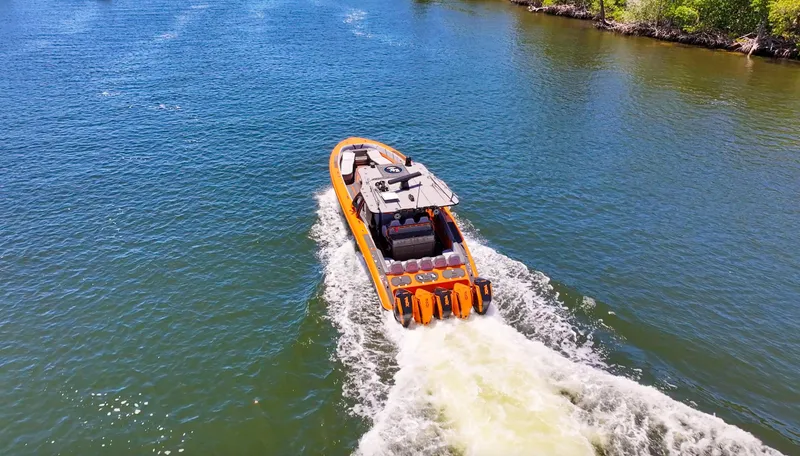  Yacht Photos Pics 2022 Midnight Express 43 Open boat cruising on a sunny waterway.