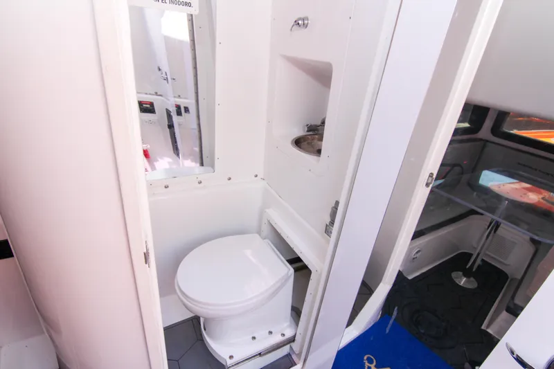  Yacht Photos Pics 2022 Midnight Express 43 Open boat bathroom interior with toilet and sink.