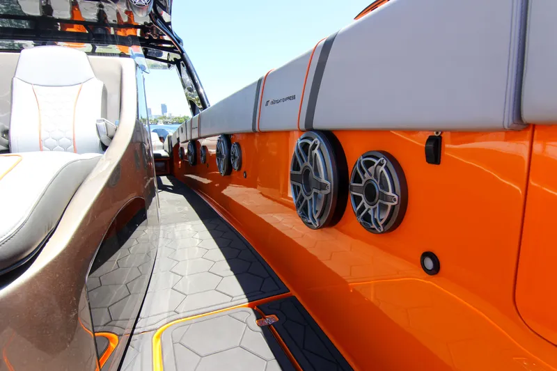  Yacht Photos Pics 2022 Midnight Express 43 Open boat interior with orange accents and modern speakers.