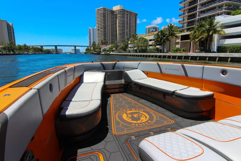  Yacht Photos Pics 2022 Midnight Express 43 Open boat interior with luxurious seating, cruising on a sunny waterway.