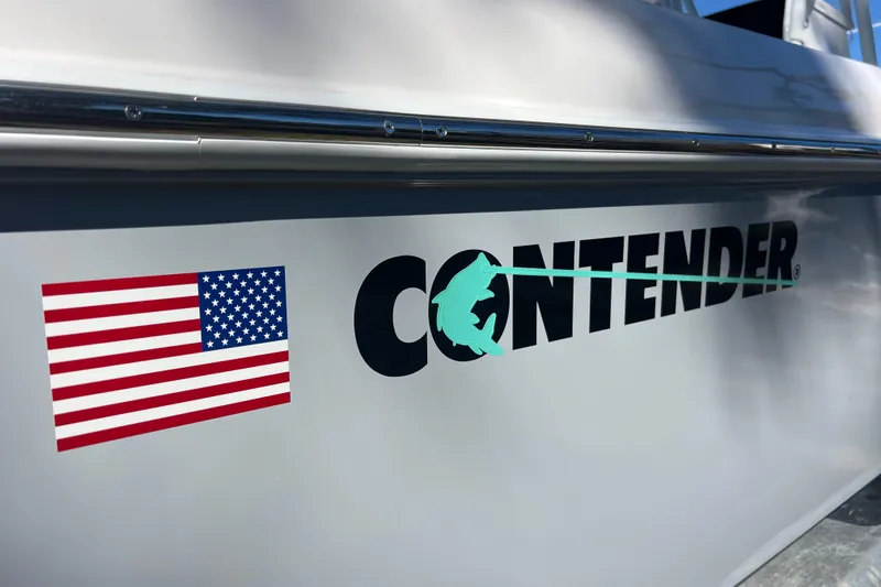  Yacht Photos Pics 2026 Contender 29 Bay boat with American flag and logo on the side.