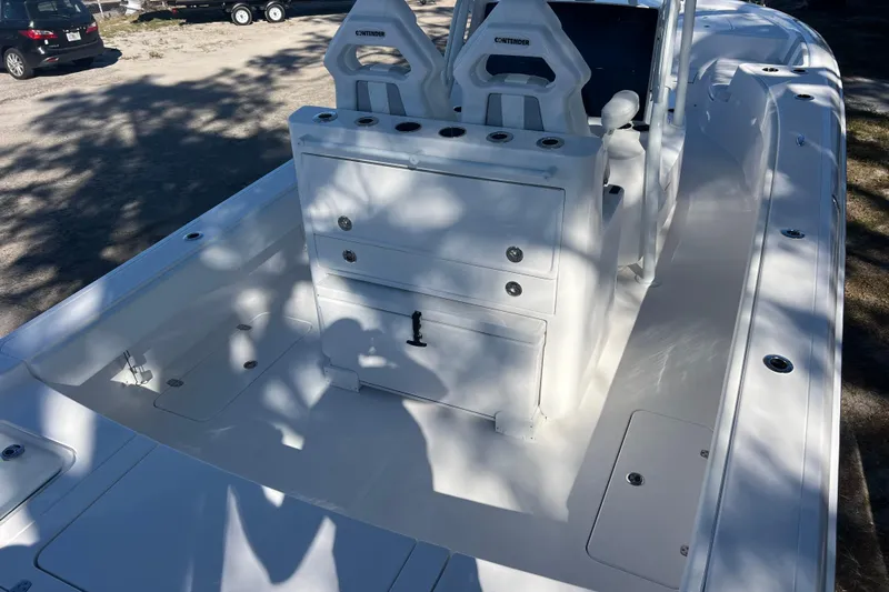  Yacht Photos Pics 2026 Contender 29 Bay boat interior with seating and storage compartments.