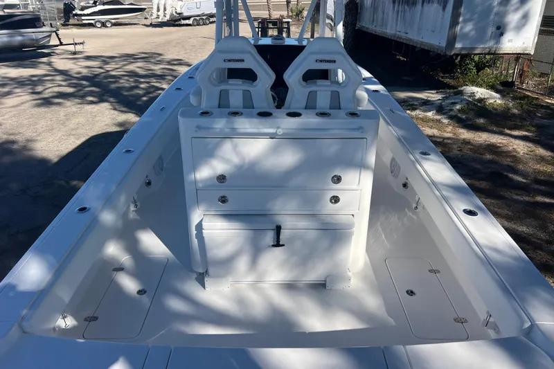 Yacht Photos Pics 2026 Contender 29 Bay boat interior with dual seats and storage compartments.
