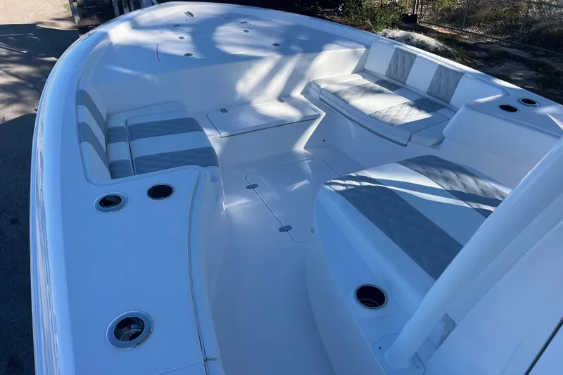  Yacht Photos Pics 2026 Contender 29 Bay boat interior with cushioned seating and cup holders.