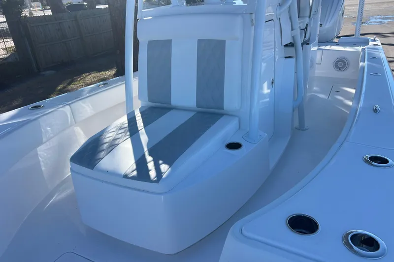  Yacht Photos Pics 2026 Contender 29 Bay boat interior with cushioned seating and cup holders.
