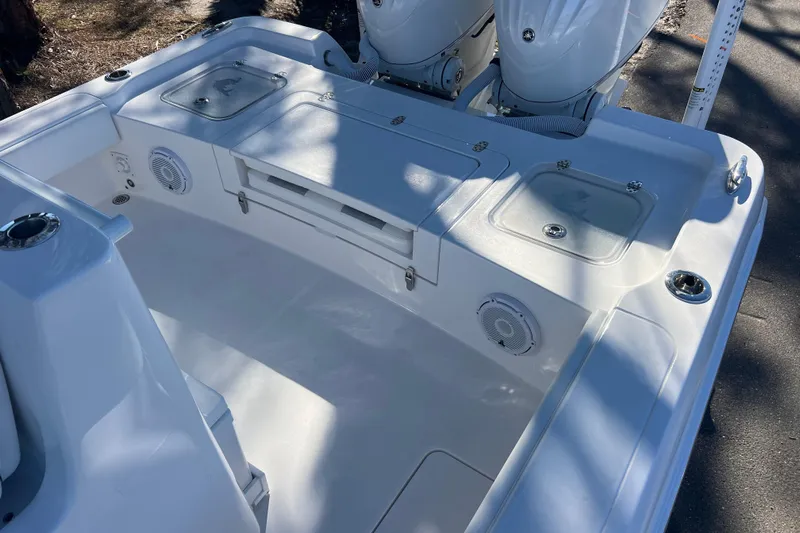  Yacht Photos Pics 2026 Contender 29 Bay boat interior with storage compartments and dual engines.