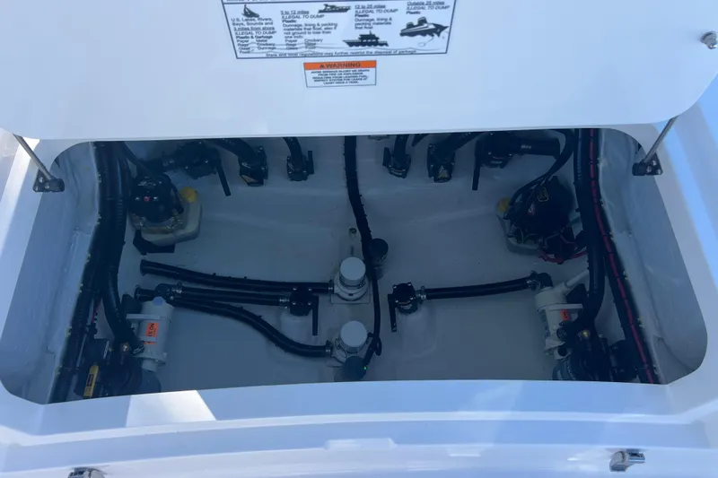  Yacht Photos Pics 2026 Contender 29 Bay boat compartment with visible wiring and components.